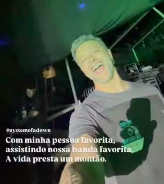 Lucas Lima curtindo o show de System Of A Down com o Theo