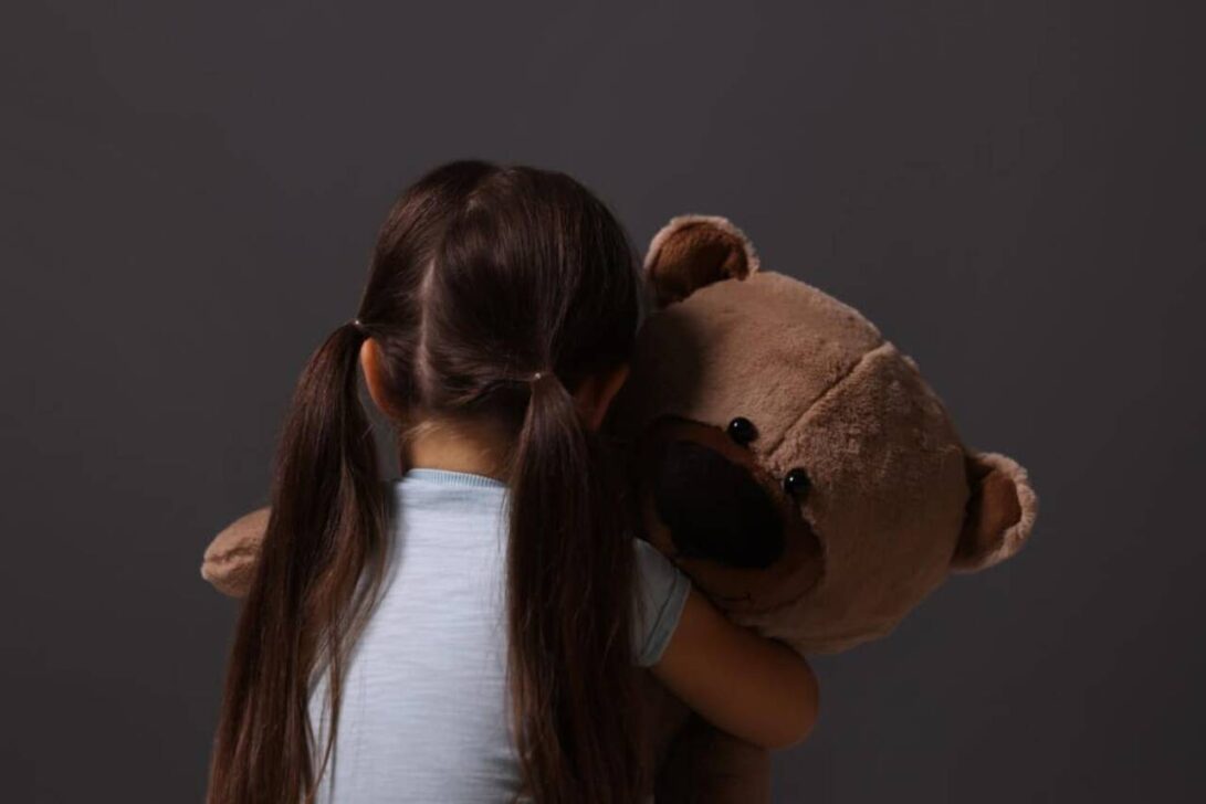 child with teddy bear
