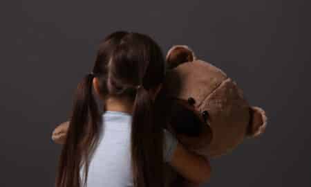 child with teddy bear
