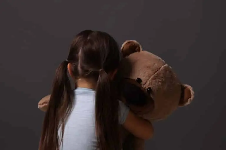 child with teddy bear