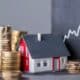 Casa, moedas, conceito de Financiamento habitacional
