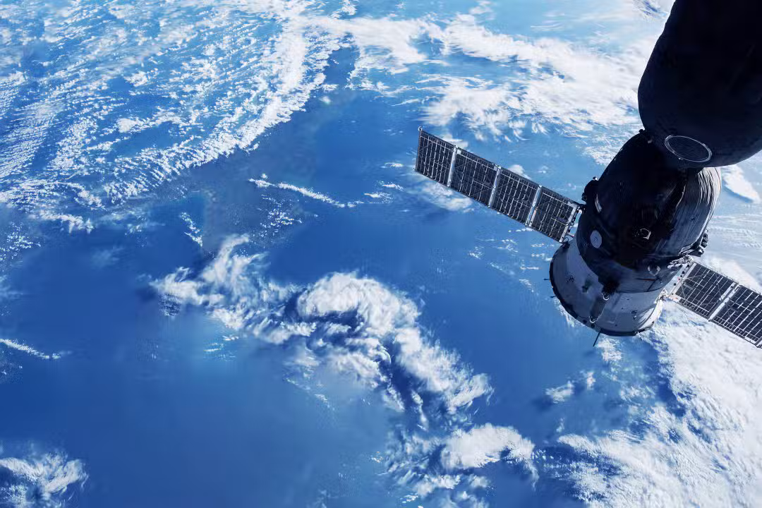 space satellite above the surface of Terra