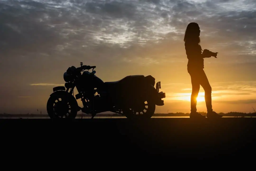 Silhueta of woman and motorcycle