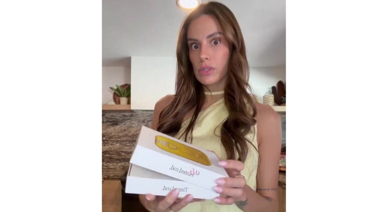 Influenciadora mostrando peixe enlatado em embalagem premium - Reprodução/ TV Globo