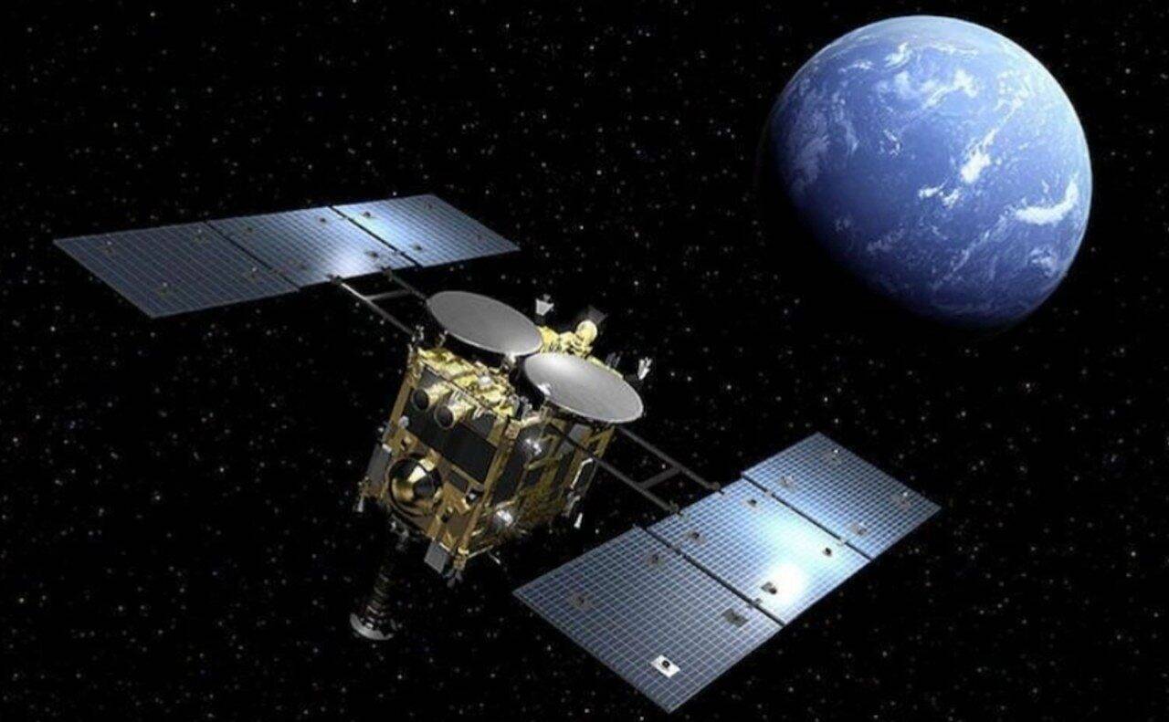 Representação artística da espaçonave Hayabusa2 passando perto da Terra - Reprodução/JAXA